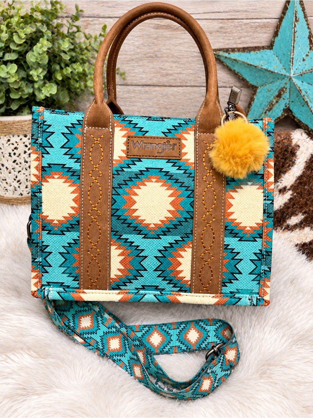 Wrangler Turquoise Aztec Crossbody Tote with Brown Trim and Yellow Pom